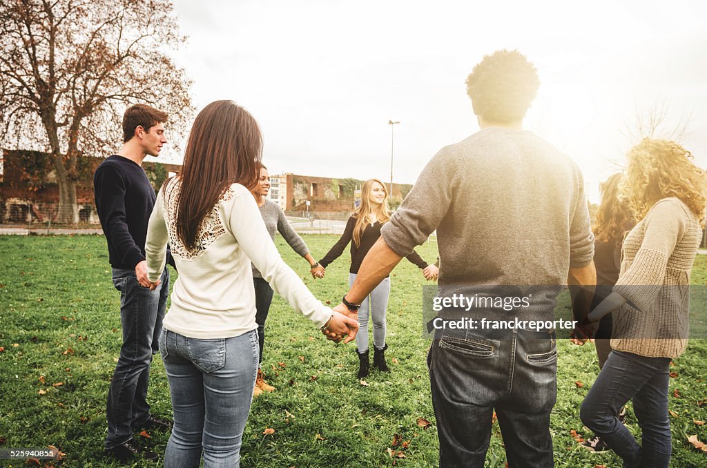 Group of teenagers volunteer happiness in circle