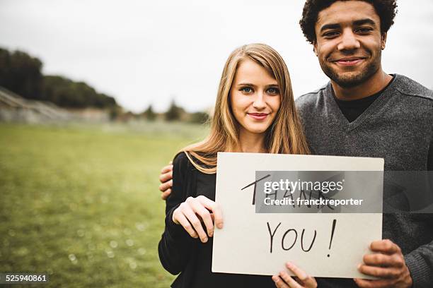 volunteer couple say thank you - thank you smile stock pictures, royalty-free photos & images