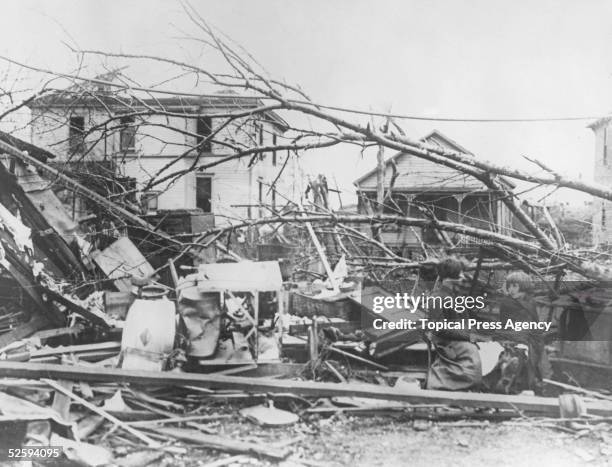 Minnie and Rose Hawkins sit amongst the wreckage of their home in Murphysboro, Illinois, in the wake of the tri-state tornado, March 1925. The...