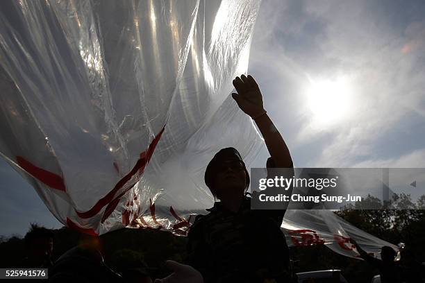 North Korean defectors, now living in South Korea prepare to release balloons carrying propaganda leaflets denouncing recent North Korea's nuclear...