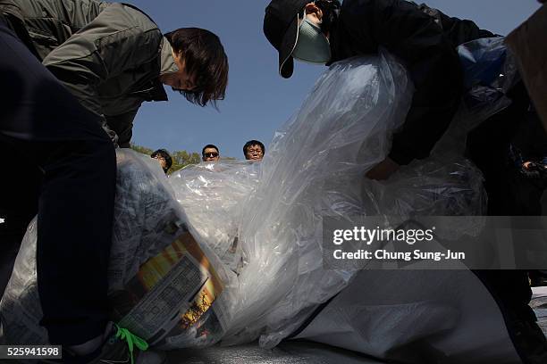 North Korean defectors, now living in South Korea prepare to release balloons carrying propaganda leaflets denouncing recent North Korea's nuclear...