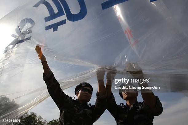 North Korean defectors, now living in South Korea prepare to release balloons carrying propaganda leaflets denouncing recent North Korea's nuclear...