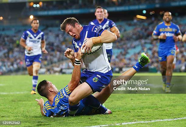Josh Morris of the Bulldogs heads for the try line to score during the round nine NRL match between the Parramatta Eels and the Canterbury Bulldogs...