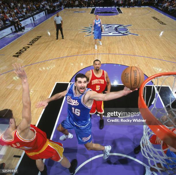 Peja Stojakovic of the Sacramento Kings goes for a layup during a game against the Houston Rockets at Arco Arena on March 13, 2005 in Sacramento,...
