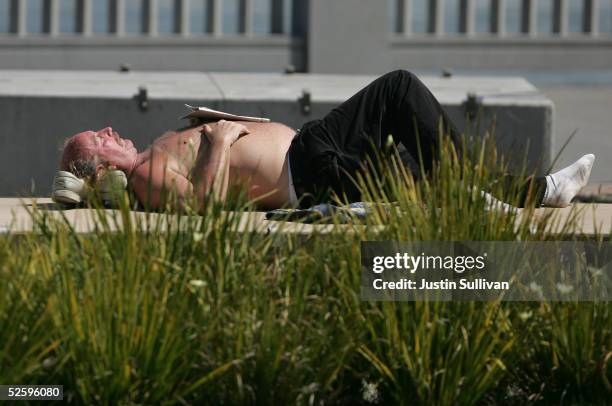 Man lays out in the sun along the Embarcadero April 6, 2005 in San Francisco. According to a study released Tuesday, almost 53 percent of...