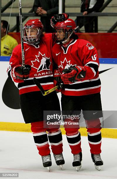 Danielle Goyette Jayna Hefford of team Canada celebrate a goal in first period against team Sweden in a IIHF World Women's Championships preliminary...