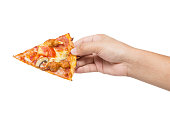 hand holding tasty flavorful pizza isolated on white