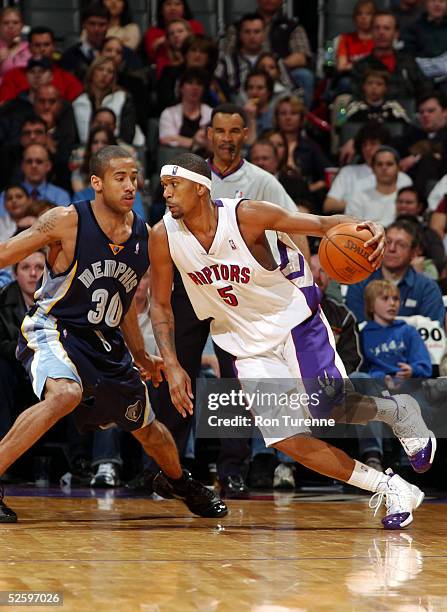 Jalen Rose of the Toronto Raptors drives against Dahntay Jones of the Memphis Grizzlies on April 6, 2005 at the Air Canada Centre in Toronto, Canada....