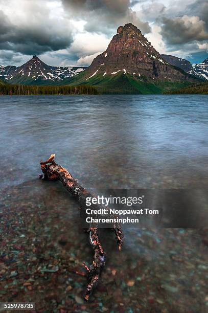 lake and mountain in glacier national park - two medicine lake montana stock pictures, royalty-free photos & images