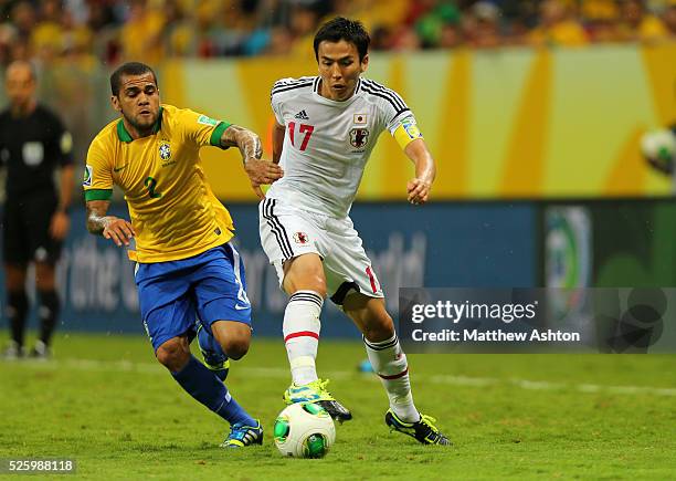 Daniel Alves of Brazil and Makoto Hasebe of Japan