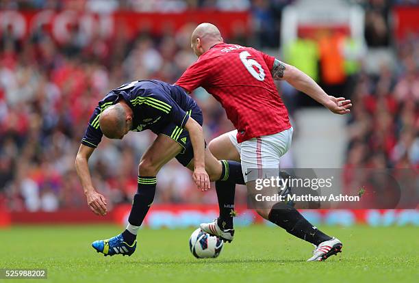 Zinedine Zidane of Real Madrid Legends and Jaap Stam of Manchester United Legends