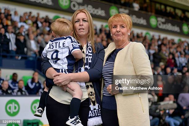 Clare Astle daughter of Jeff Astle, Jeffs grandson Joseph & widow Laraine Astle watch a video tribute to Jeff on the big screens on Jeff Astle Day...