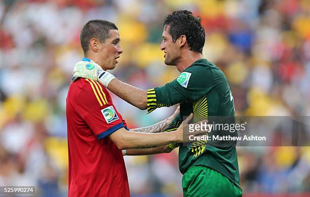 Fernando Torres of Spain consoles Mickael Roche of Tahiti