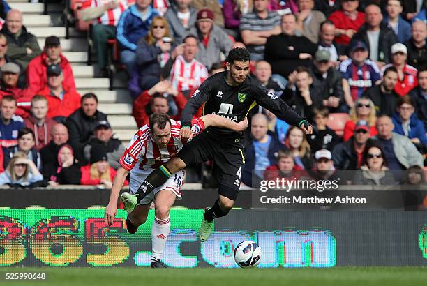 Charlie Adam of Stoke City and Bradley Johnson of Norwich City