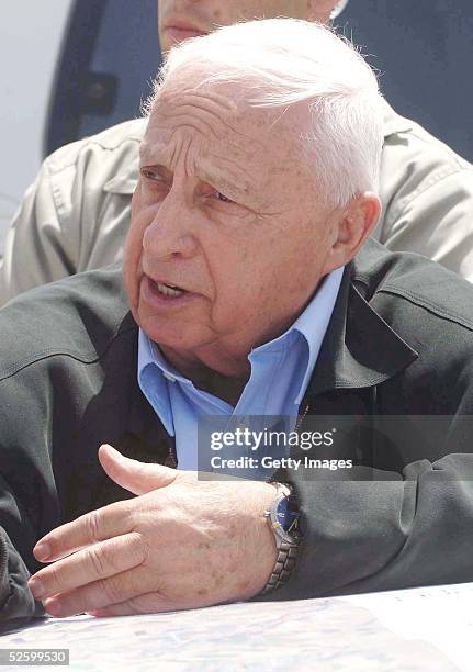 In this handout from the Israeli Government Press Office, Israeli Prime Minister Ariel Sharon tours the Nitzanim dunes, a nature reserve on April 7,...