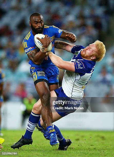 Semi Radradra of the Eels runs over James Graham of the Bulldogs during the round nine NRL match between the Parramatta Eels and the Canterbury...