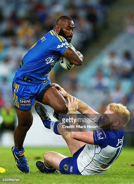 Semi Radradra of the Eels runs over James Graham of the Bulldogs during the round nine NRL match between the Parramatta Eels and the Canterbury...