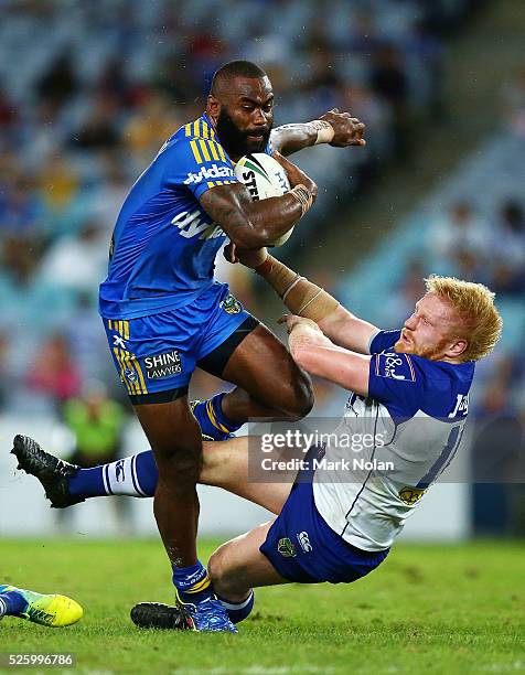 Semi Radradra of the Eels runs over James Graham of the Bulldogs during the round nine NRL match between the Parramatta Eels and the Canterbury...