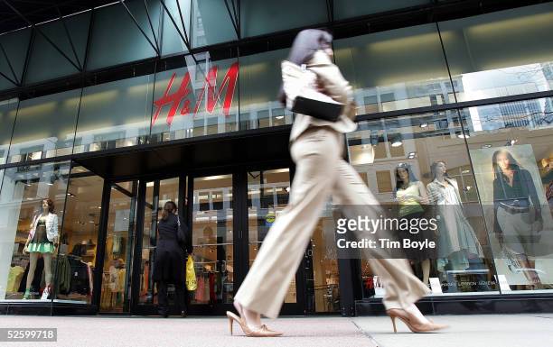 Woman walks past an H&M clothing store April 7, 2005 in Chicago, Illinois. Sweden's Hennes & Mauritz, AB , Europe's largest fashion retailer, has...