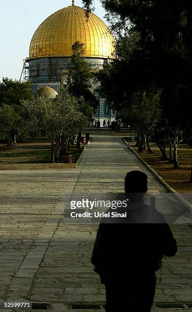 An Israeli policeman looks towards the golden Dome of the Rock Islamic shrine on April 7, 2005 in Jerusalem's Old City, Israel. Israel's Shin Bet...