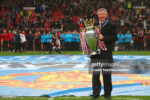 Sir Alex Ferguson the head coach / manager of Manchester United with the Barclays Premier League trophy