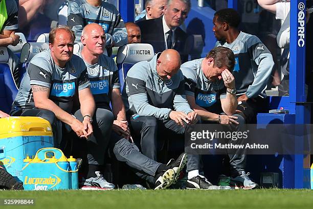 Dejected John Carver caretaker manager of Newcastle United and Steve Stone first team coach of Newcastle United