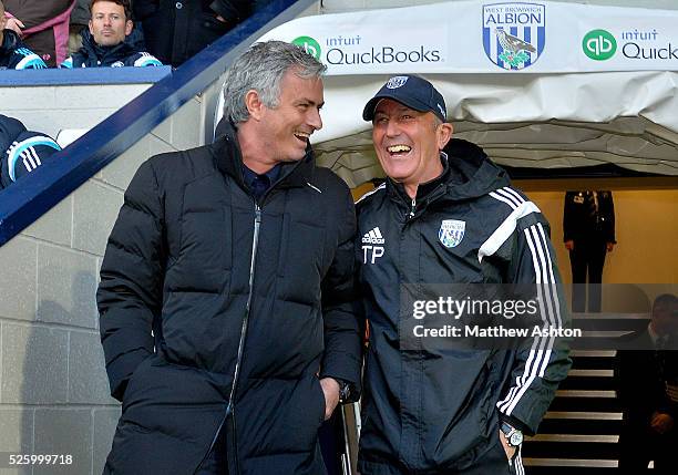 Jose Mourinho head coach / manager of Chelsea and Tony Pulis head coach / manager of West Bromwich Albion share a joke as they exit the tunnel before...