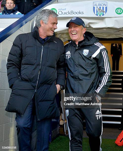 Jose Mourinho head coach / manager of Chelsea and Tony Pulis head coach / manager of West Bromwich Albion share a joke as they exit the tunnel before...