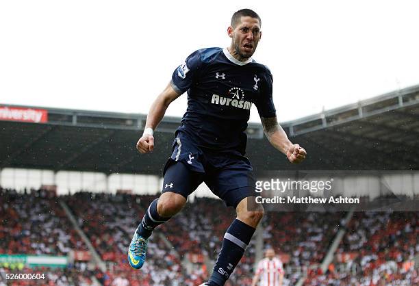 Clint Dempsey of Tottenham Hotspur celebrates after Emmanuel Adebayor of Tottenham Hotspur scores a goal to make it 1-2