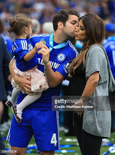 Cesc Fabregas of Chelsea kisses partner Daniella Semaan as he holds their daughter Lia