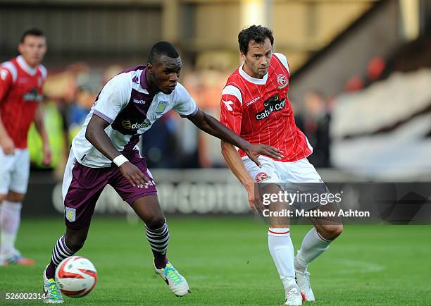 Ben Purkiss of Walsall and Christian Benteke of Aston Villa