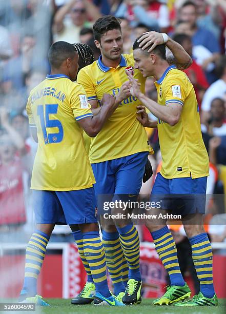 Laurent Koscielny of Arsenal celebrates with Olivier Giroud of Arsenal after scoring to make it 2-2