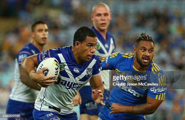 Will Hopoate of the Bulldogs runs the ball during the round nine NRL match between the Parramatta Eels and the Canterbury Bulldogs at ANZ Stadium on...