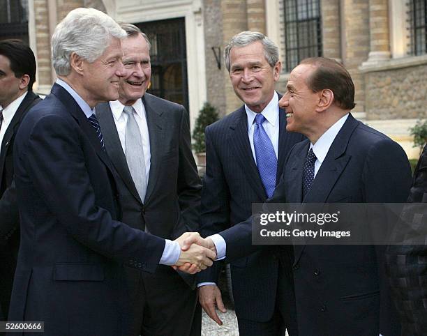 In this handout image provided by the White House, U.S. President George W. Bush and his father, former U.S. President George H.W. Bush , look on as...