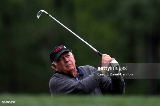 Billy Casper watches his tee shot on the 12th hole during the first round of The Masters at the Augusta National Golf Club on April 7, 2005 in...