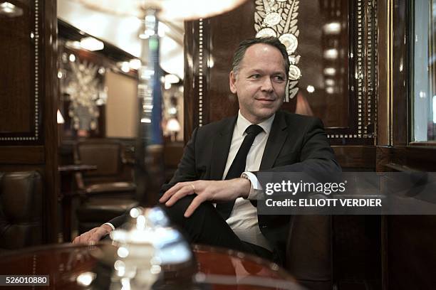 French Orient Express president Patrick Ropert poses for photographs in the Orient Express during the inauguration of "La table de l'Orient Express"...