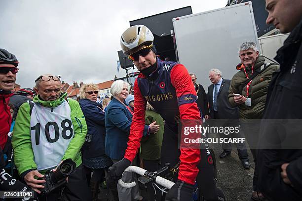 British cyclist Bradley Wiggins, riding for Team Wiggins, makes his way to the start line to compete in the first stage of the Tour de Yorkshire, in...