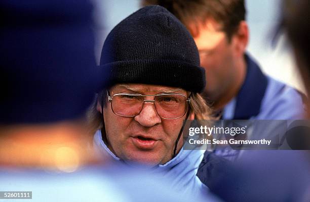 Tommy Raudonikis, coach of the New South Wales Blues talks to his players during a training session prior to the 1997 State of Origin match between...