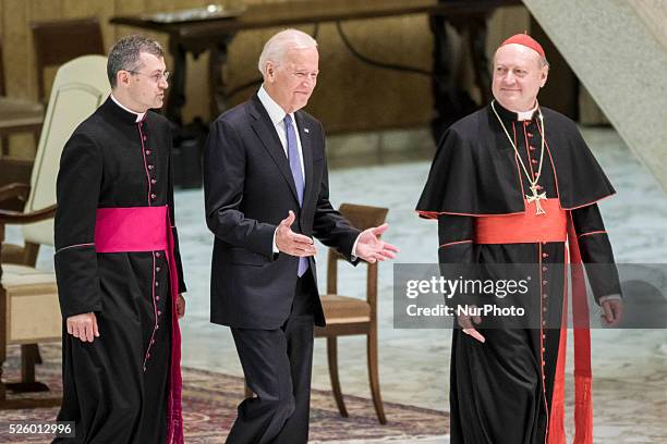 Vice President Joe Biden is flanked by Cardinal Gianfranco Ravasi as he arrives to attend a special audience celebrates by Pope Francis with...