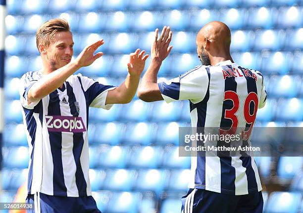 Markus Rosenberg of West Bromwich Albion celebrates with Nicolas Anelka after scoring a goal to make it 1-0