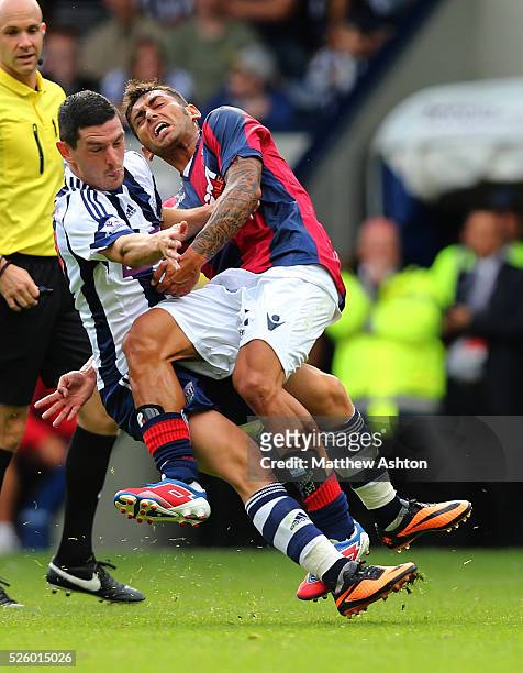 Graham Dorrans of West Bromwich Albion clashes with Michele Pazienza of Bologna