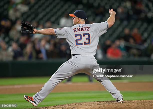 Erik Kratz of the Houston Astros delivers a pitch during a game against the Seattle Mariners at Safeco Field on April 26, 2016 in Seattle,...
