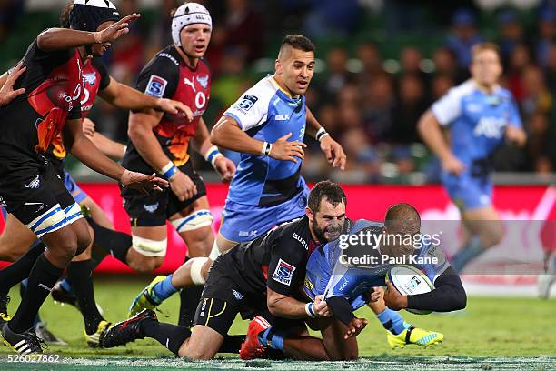 Marcel Brache of the Force gets tackled by Francois Brummer of the Bulls during the round 10 Super Rugby match between the Force and the Bulls at nib...