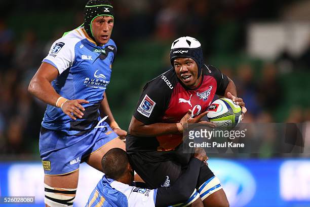 Marvin Orie of the Bulls gets tackled by Marcel Brache of the Force during the round 10 Super Rugby match between the Force and the Bulls at nib...