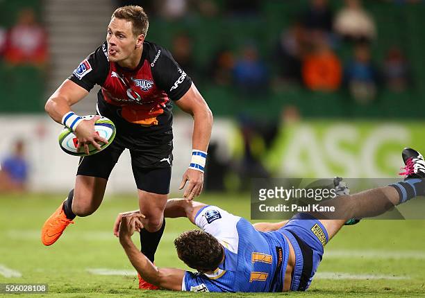 Sarel Marais of the Bulls passes the ball before being tackled by Luke Morahan of the Force during the round 10 Super Rugby match between the Force...