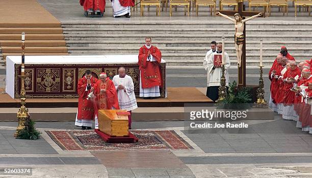 Cardinal Joseph Ratzinger waves incense over the coffin of Pope John Paul II during his funeral March 8, 2005 in Vatican City. Hundreds of thousands...