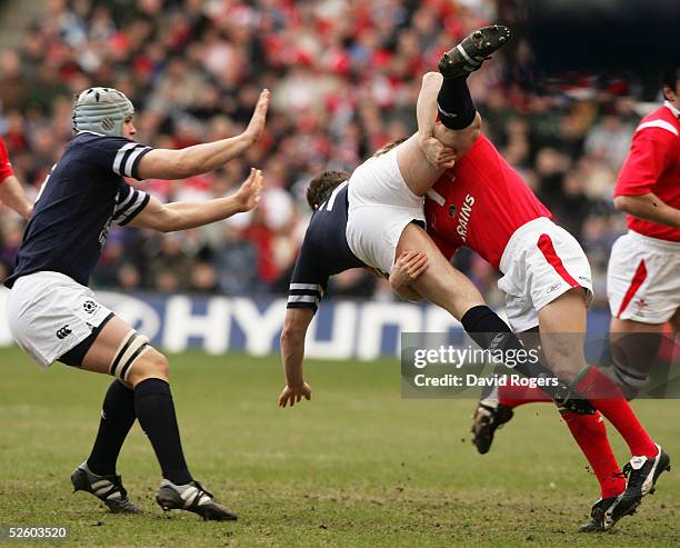 Scotland's Gordon Bulloch is upended by Dwayne Peel of Wales during the RBS Six Nations International between Scotland and Wales at Murrayfield on...