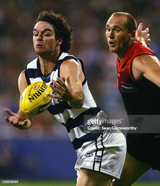 Matthew Scarlett for Geelong and David Neitz for Melbourne in action during the AFL round 3 match between the Melbourne Demons and Geelong Cats at...