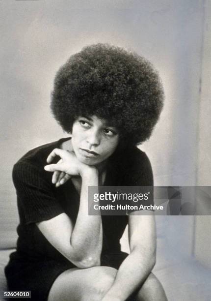 American revolutionary and educator Angela Davis sits with her head on her hand, shortly after she was fired from her post as philosophy professor at...