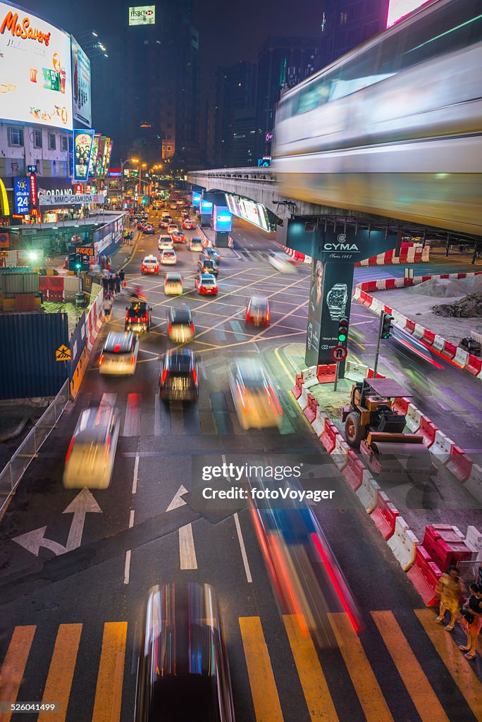 City rush hour traffic futuristic neon night Kuala Lumpur Malaysia